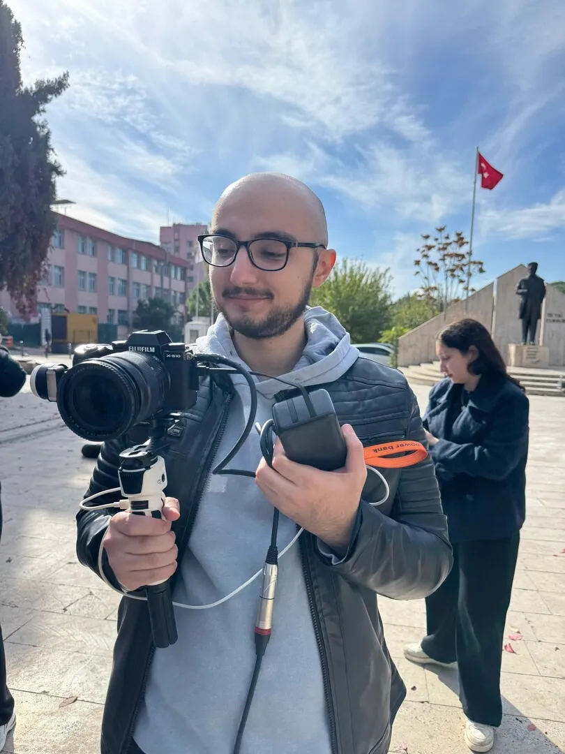 Operating a camera on a gimbal in a sunny courtyard